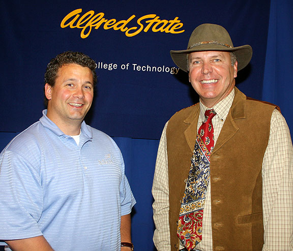 Alfred State College President Dr. John M. Anderson, right, congratulates Stevens on his award.